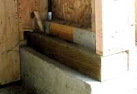 Base of the front wall of the garage